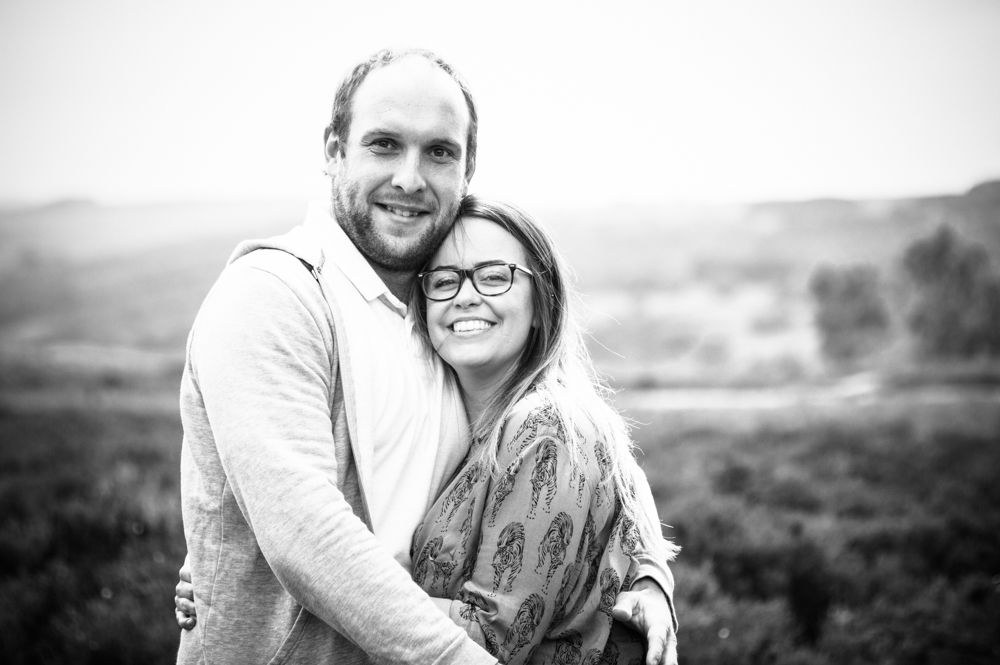 Max and Louisa cuddling at Surprise View, Sheffield wedding photographers