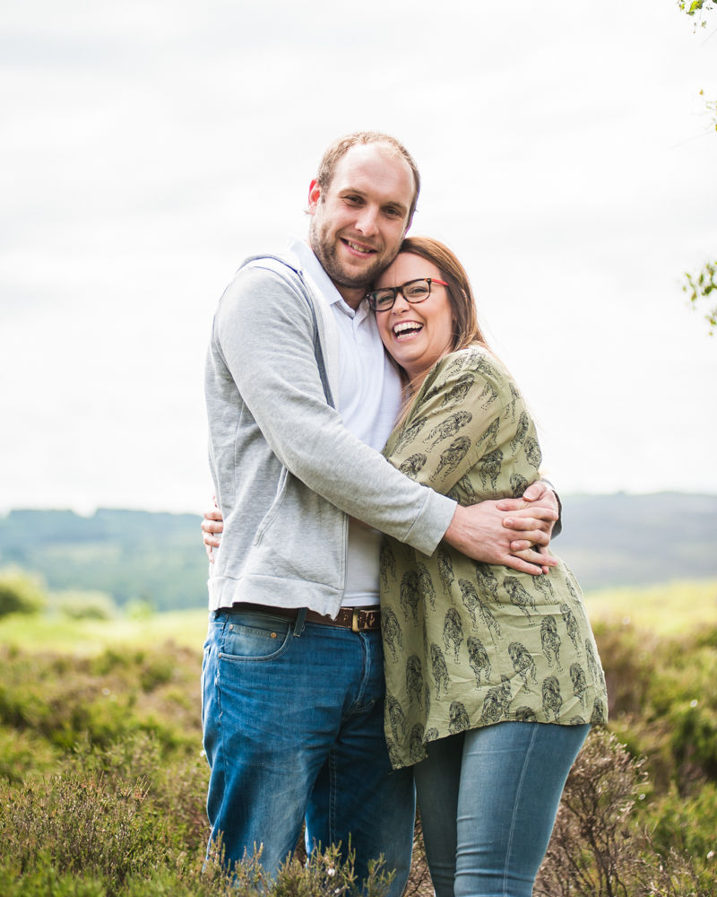 Laughing on pre-wedding photo shoot, Surprise View, Peak District