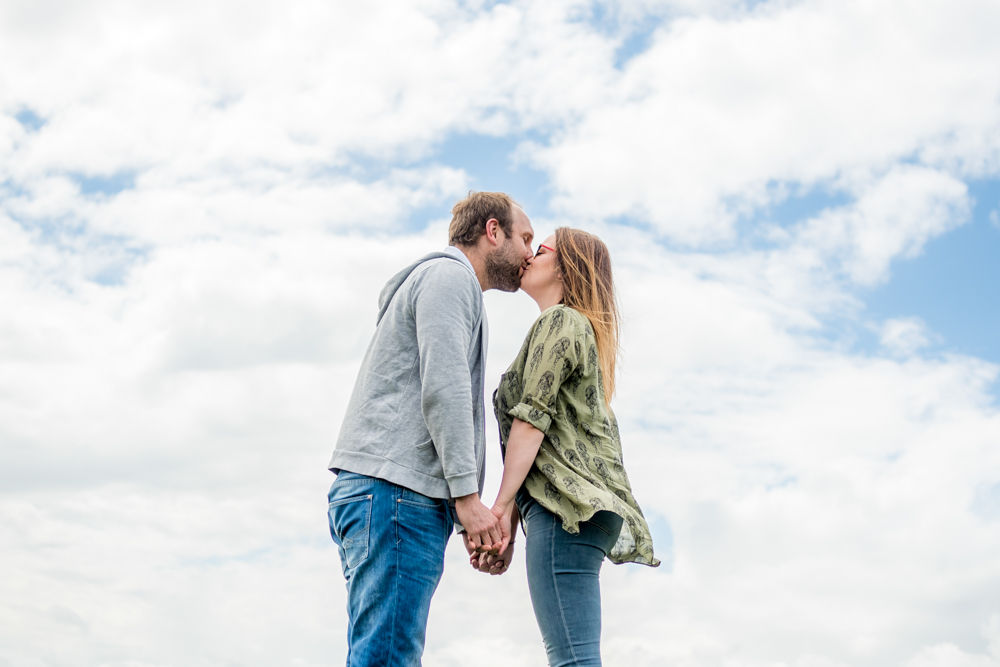 Kissing on top of rock, Sheffield wedding photographers