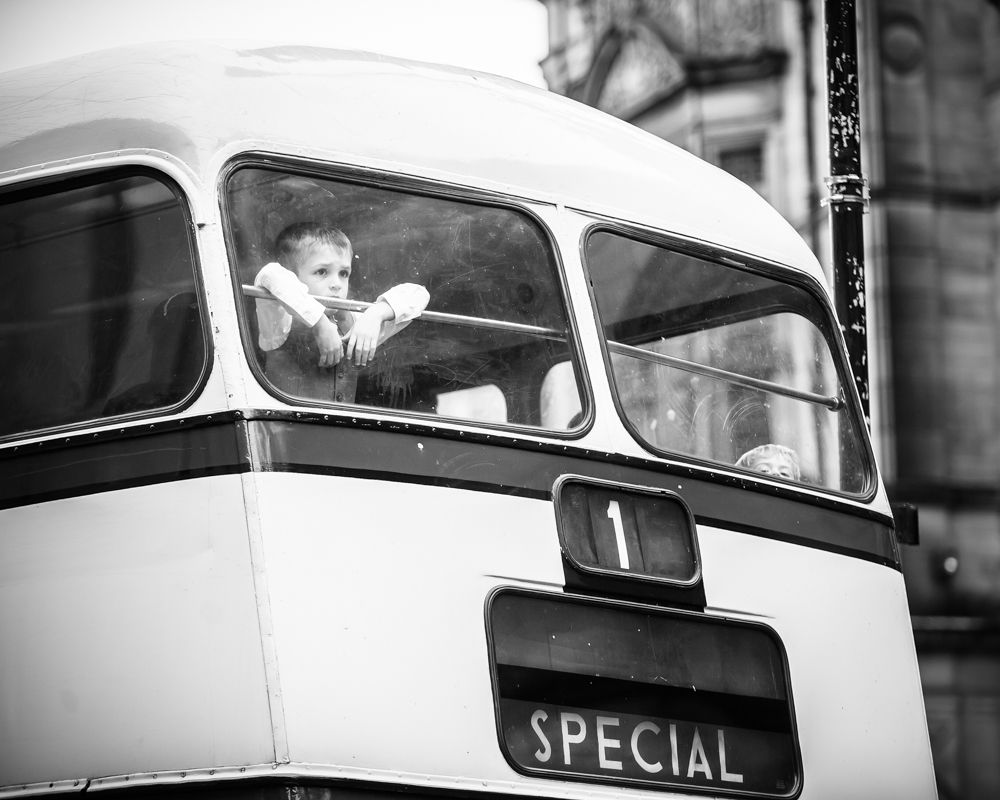 pageboy looking out of bus, Peace Gardens wedding poses, Sheffield wedding photographer