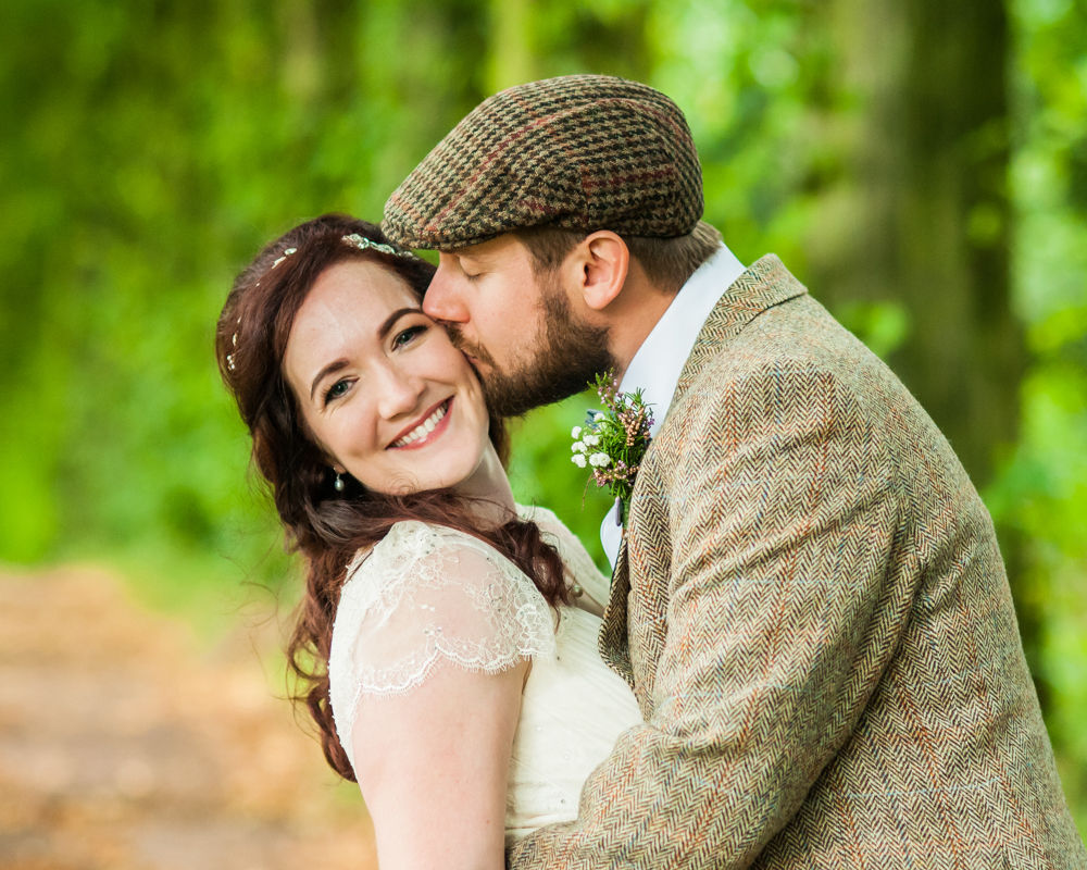 Kisses on cheek,  Wentworth Castle Garden wedding, Sheffield photographers