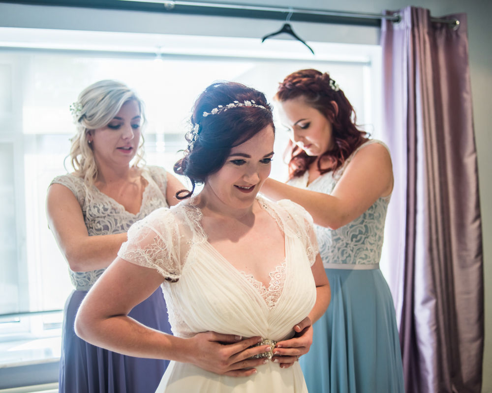 Bride getting in dress,  Wentworth Castle Garden wedding, Sheffield photographers
