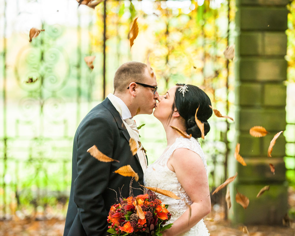 Kisses unfer fallen leaves, Wortley Hall wedding, Sheffield wedding photographers