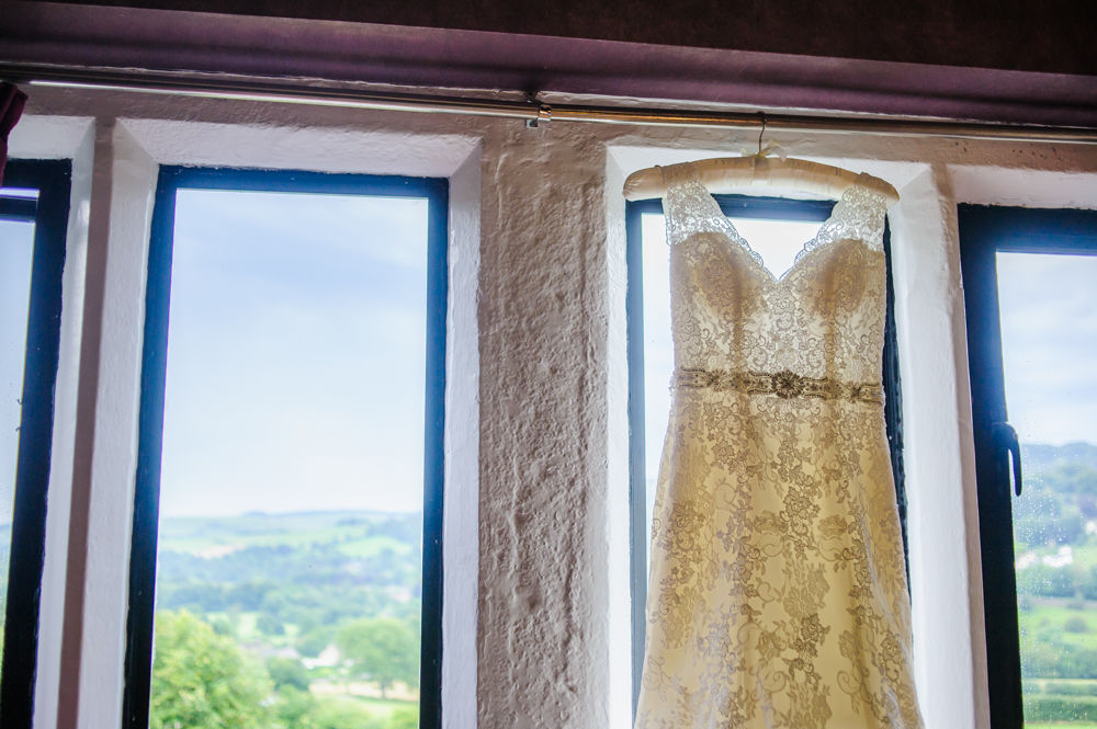 Wedding dress hanging up, Maynard wedding photography Sheffield