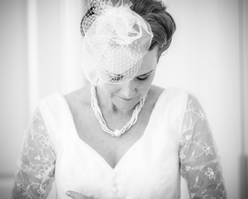 Beth putting on dress, Sheffield wedding photographers