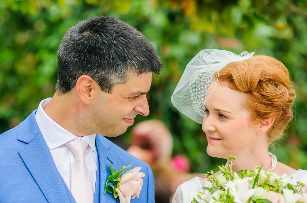 Bride and groom looking at each other at top of aisle, Yorkshire weddings