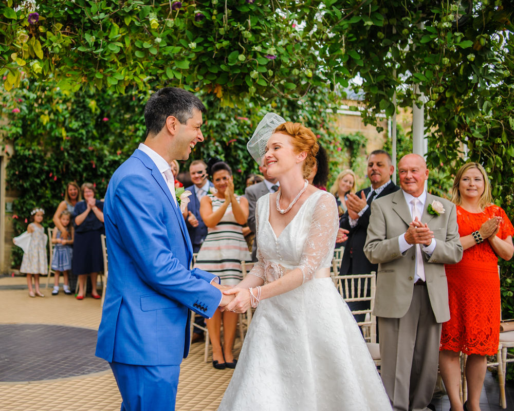 Laughing in ceremony, Cumbria wedding photographers