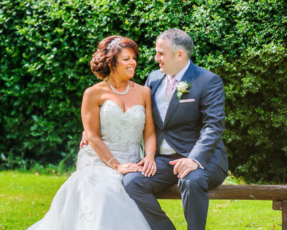 Chatting on a bench, Whitley Hall weddings, Sheffield wedding photographers
