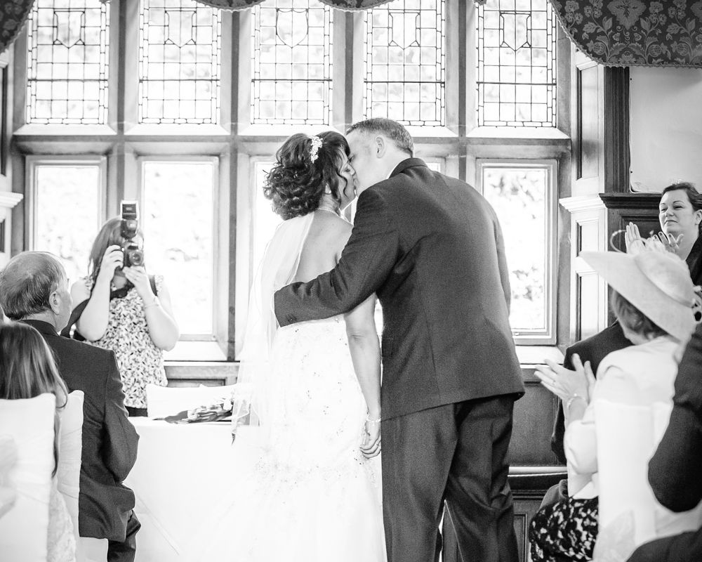 First kiss during ceremony, Whitley Hall weddings, Sheffield wedding photographers
