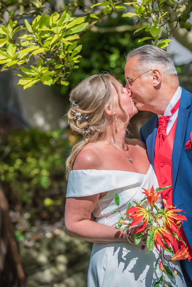 Kisses for bride and groom, elopement wedding Lake District