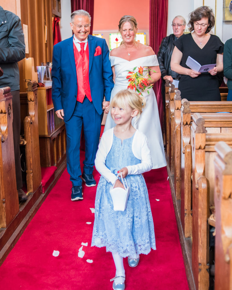 Flowergirl sprinkling petals, Cumbria wedding, Kendal