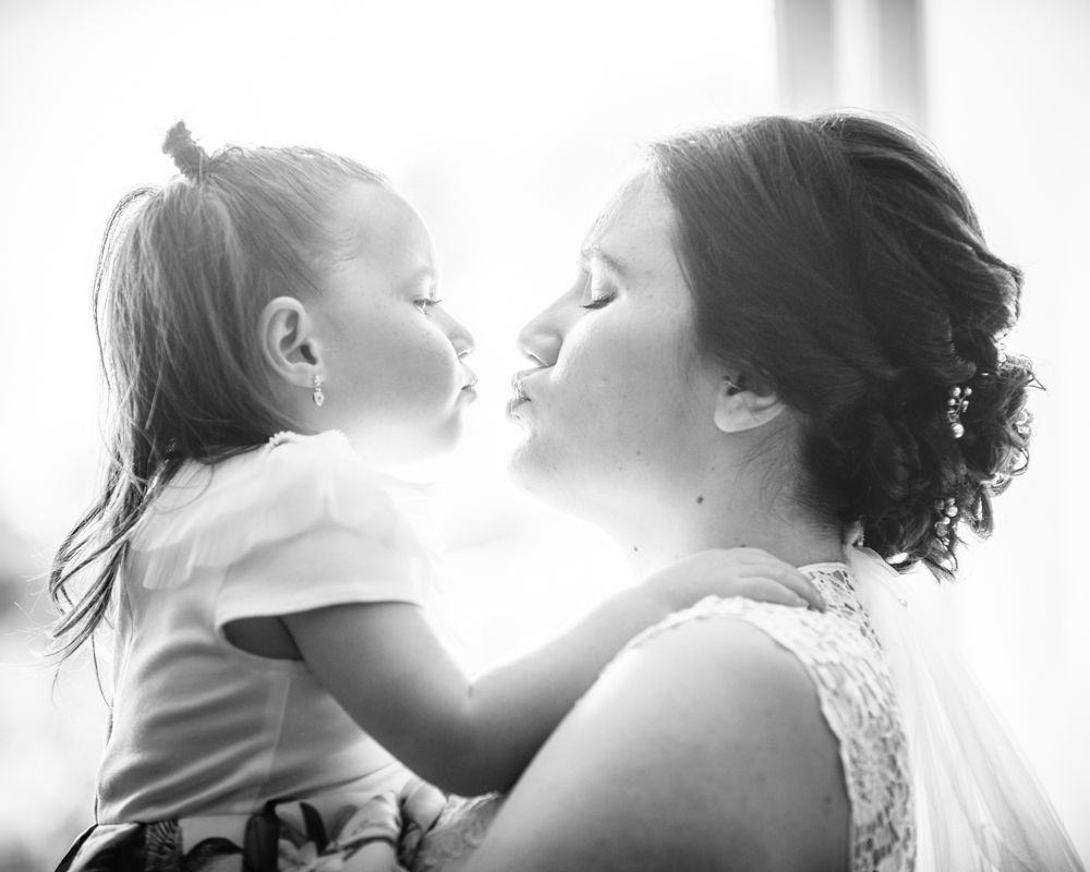 Flower girl kisses for bride, Gretna Green wedding photographers