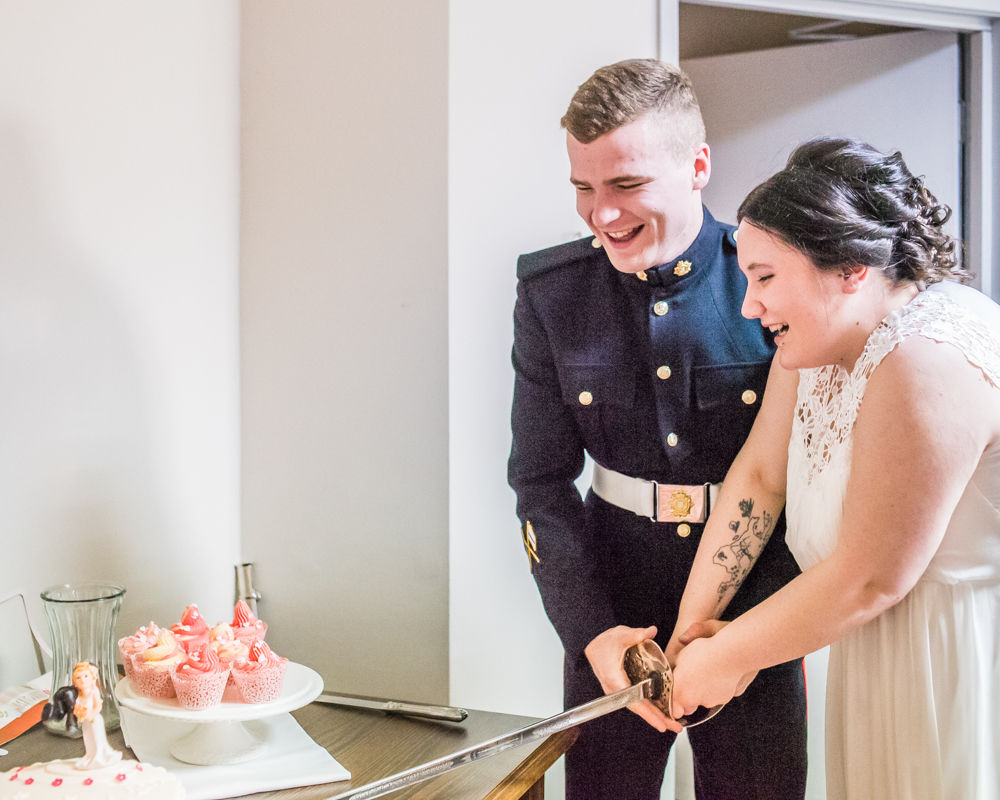 Cutting the cake with sword, Greens at Gretna weddings