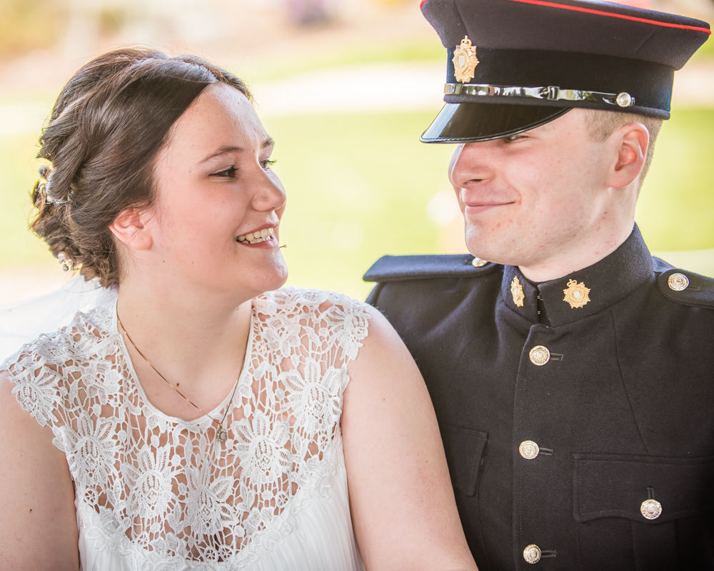Bride and groom looking at each other during register signing, Gretna Green weddings