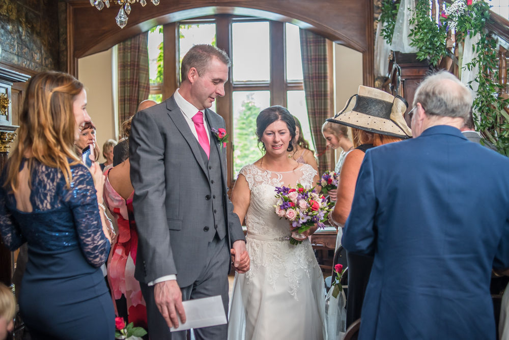 Walking down aisle, Lingholm wedding, Lake District
