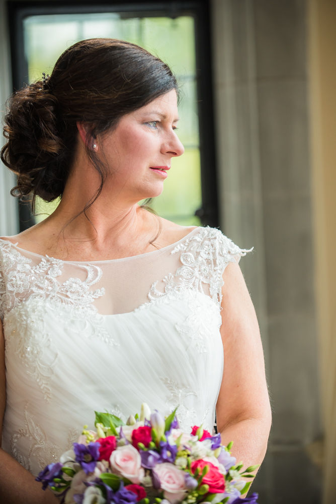 Bride looking out of window, Lingholm wedding, Lake District