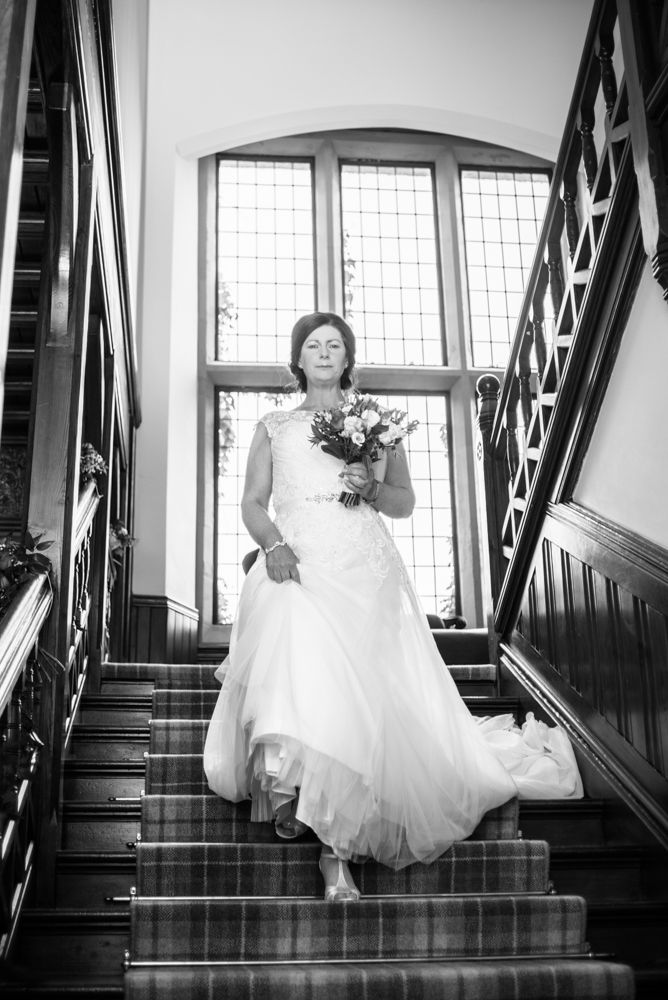 Gill walking downstairs to wedding, Lingholm wedding, Lake District