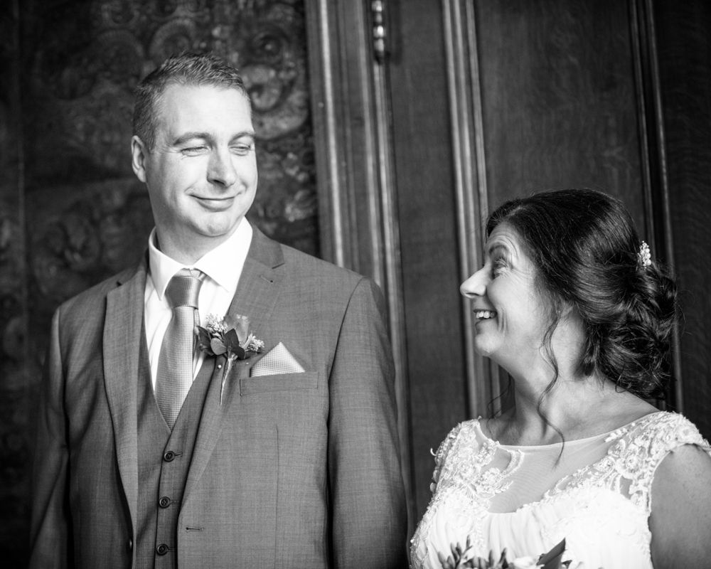 Exchanging looks during ceremony, Lingholm wedding, Lake District
