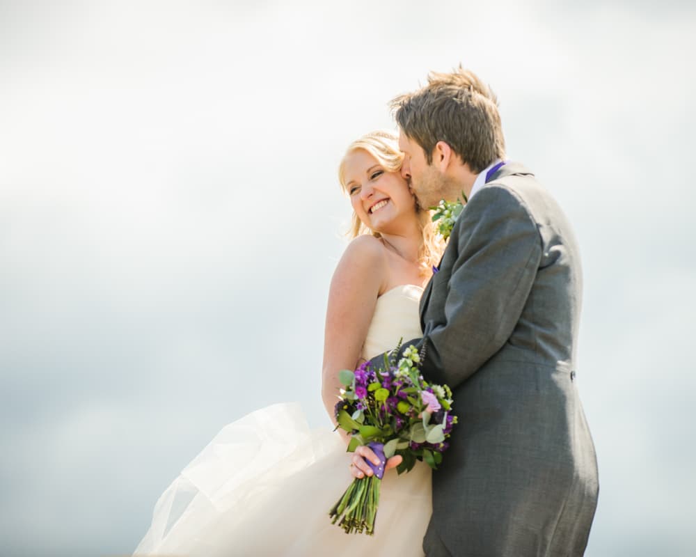 Kisses on Peak District rocks, Maynard wedding, Sheffield photographers