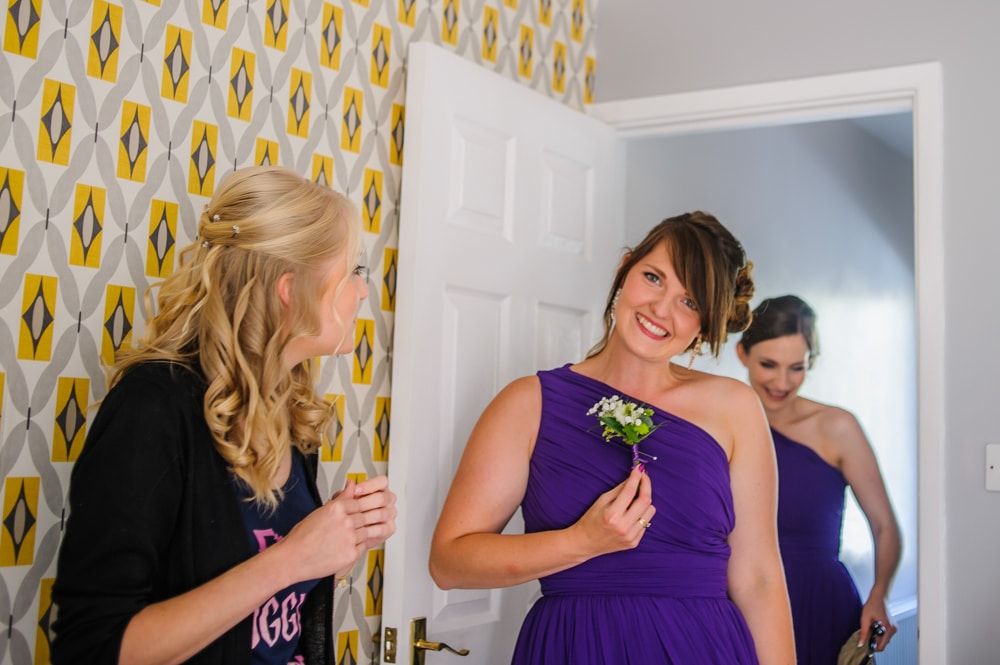 Checking out the buttonholes, Maynard wedding, Sheffield photographers