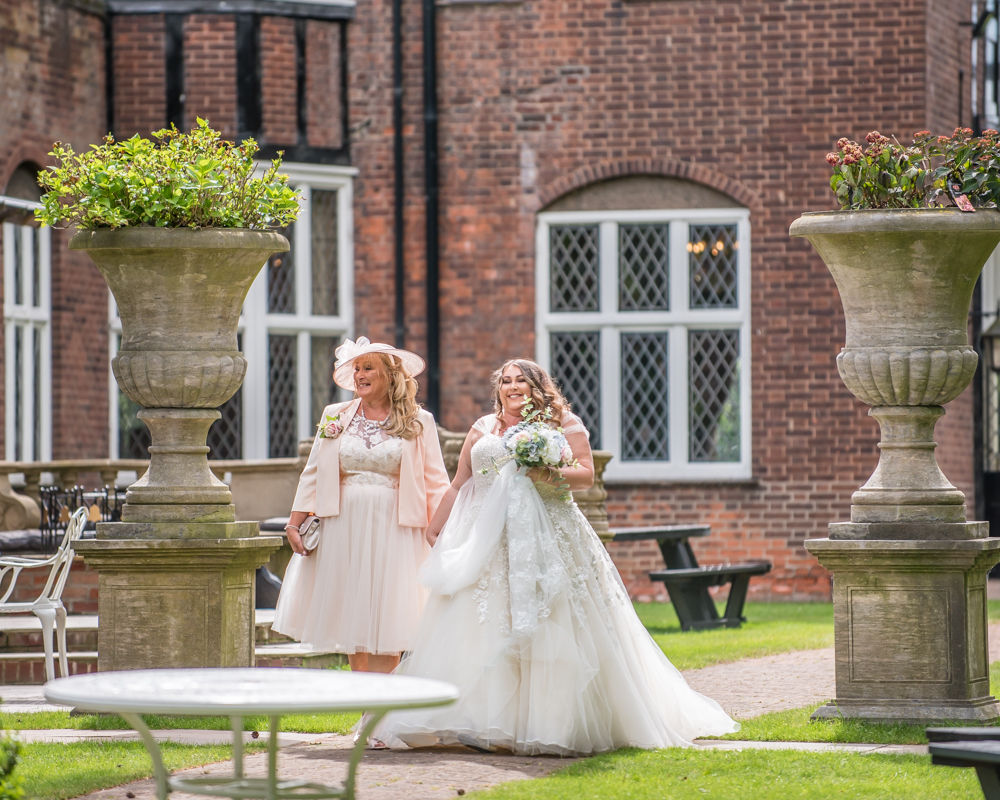 Bride and Mum walking up aisle, Ye Olde Bell wedding, Retford