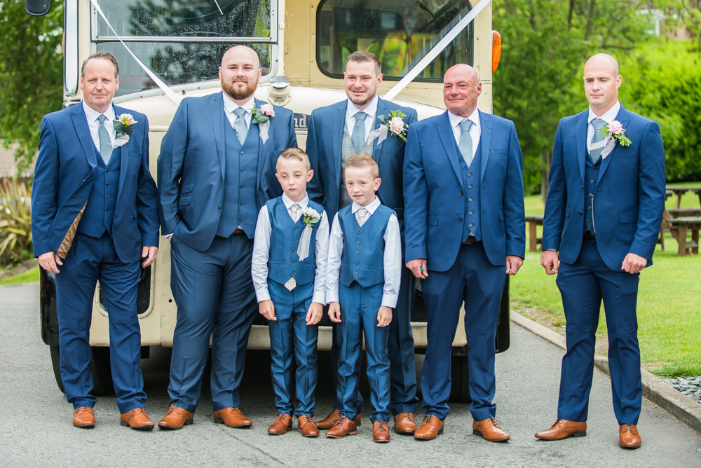 Groomsmen posing outside vintage bus, Sheffield wedding