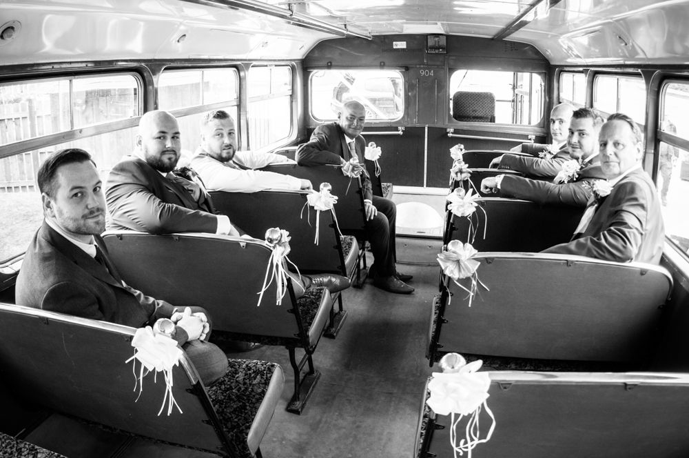Groomsmen on the vintage bus