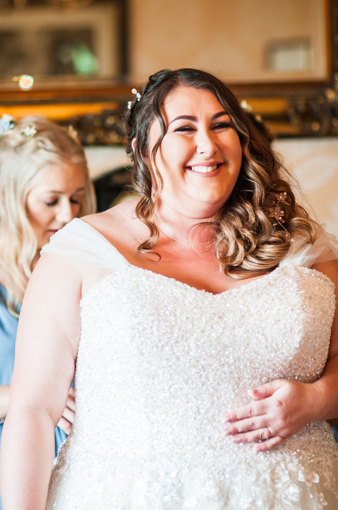 Alex getting her dress on, Yorkshire weddings