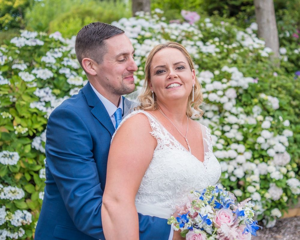 Laughing by the flowers, Lake District weddings