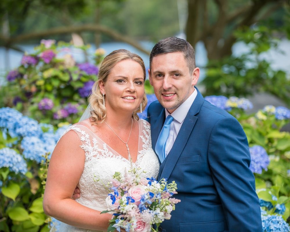 Bride and groom in the gardens of Lakeside Hotel, Windermere