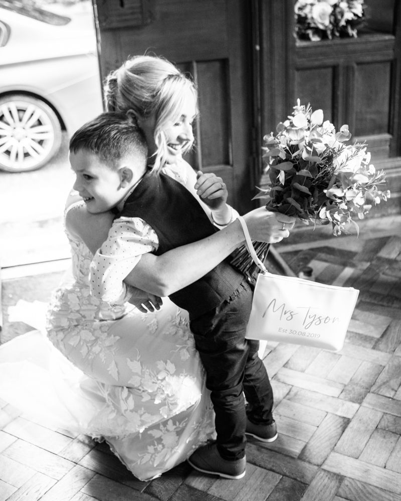 Milo hugging his Mum, wedding photographers Carlisle register office elopement wedding Lake District