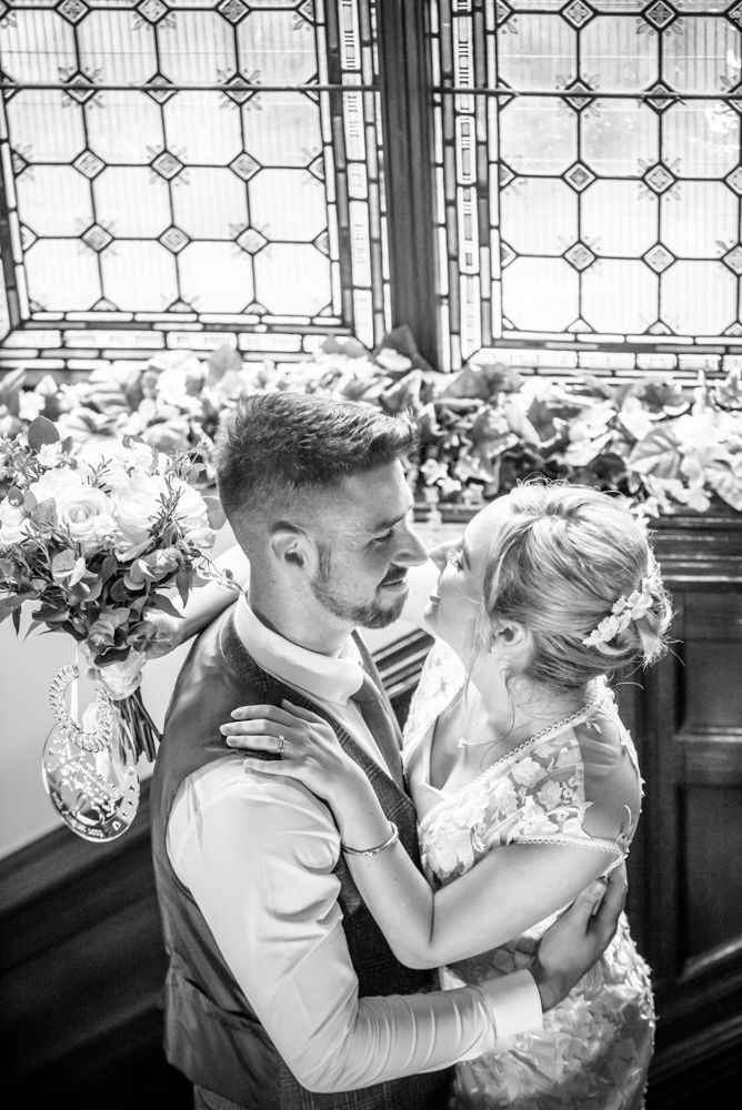 Together on the staicase,  wedding photographers Carlisle register office elopement wedding Lake District