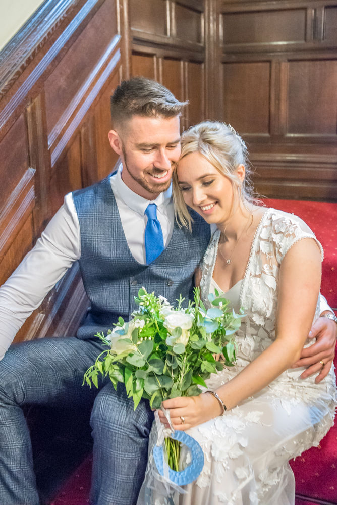 Cuddles on staircase,  wedding photographers Carlisle register office elopement wedding Lake District