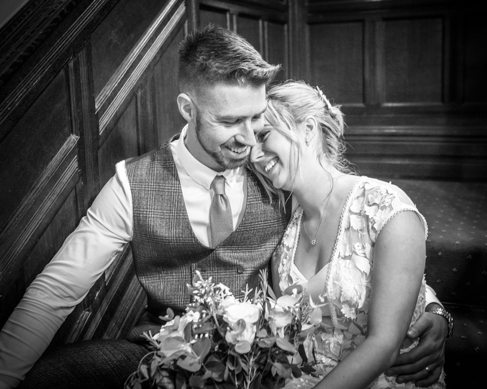 Bride and groom snuggles,  wedding photographers Carlisle register office elopement wedding Lake District