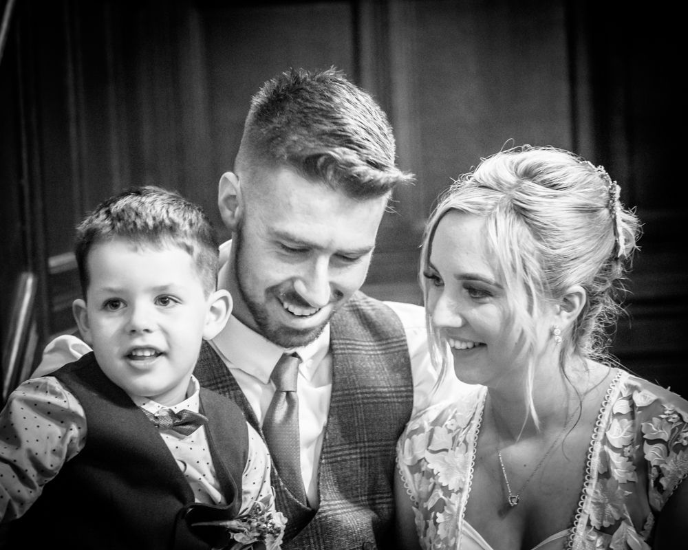 Posing with son Milo,  wedding photographers Carlisle register office elopement wedding Lake District