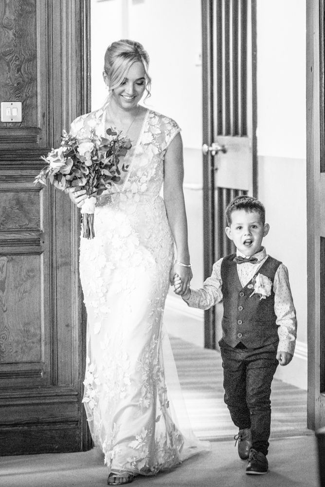 Milo walking Mum down the aisle,  wedding photographers Carlisle register office elopement wedding Lake District