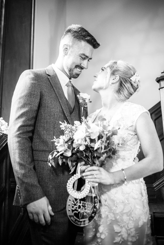 Posing on the staircase,  wedding photographers Carlisle register office elopement wedding Lake District