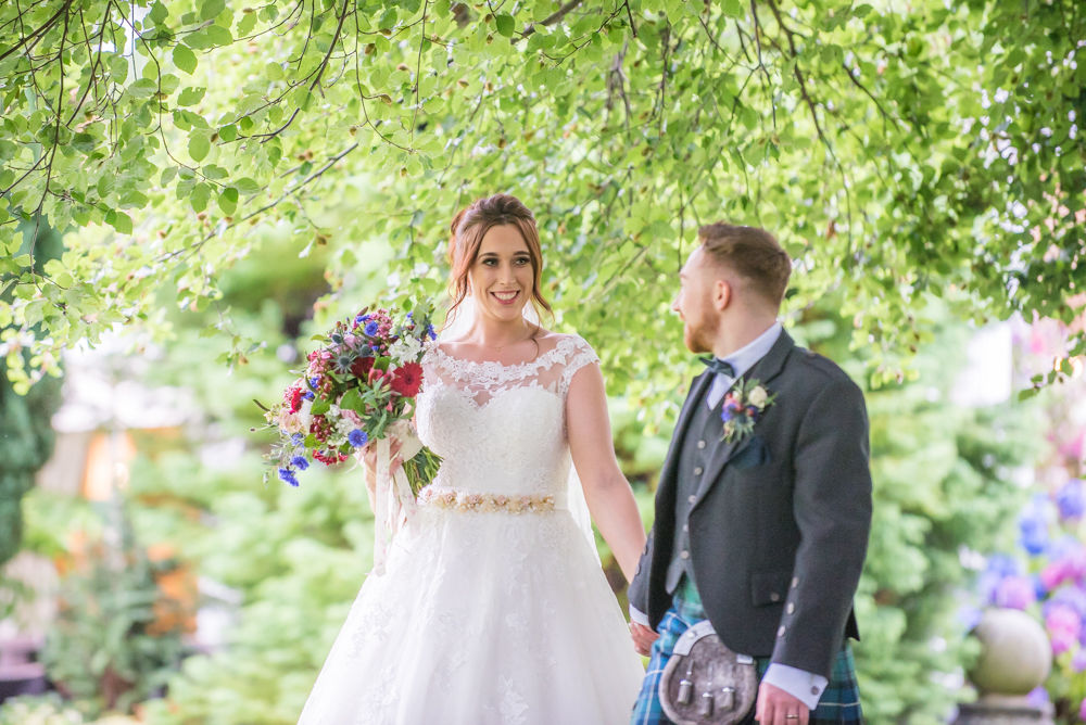 Walking through Ringwood Hall grounds. Sheffield wedding photographers, Ringwood Hall Hotel