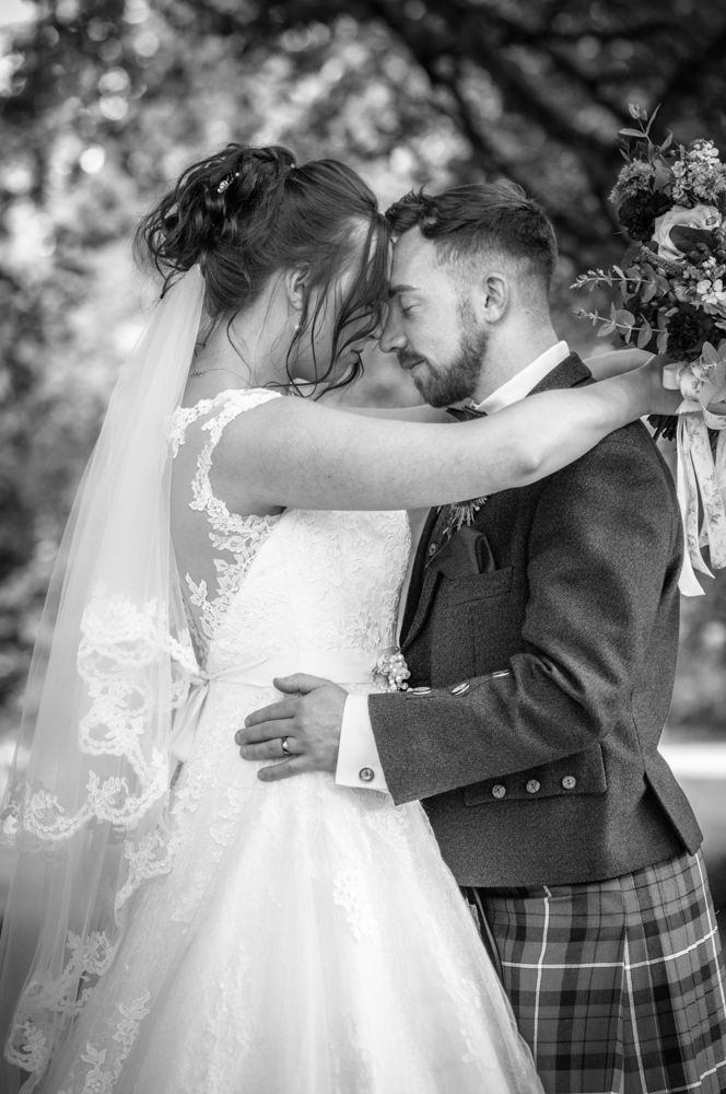 Posing with the heads resting together, Sheffield wedding photographers, Ringwood Hall Hotel