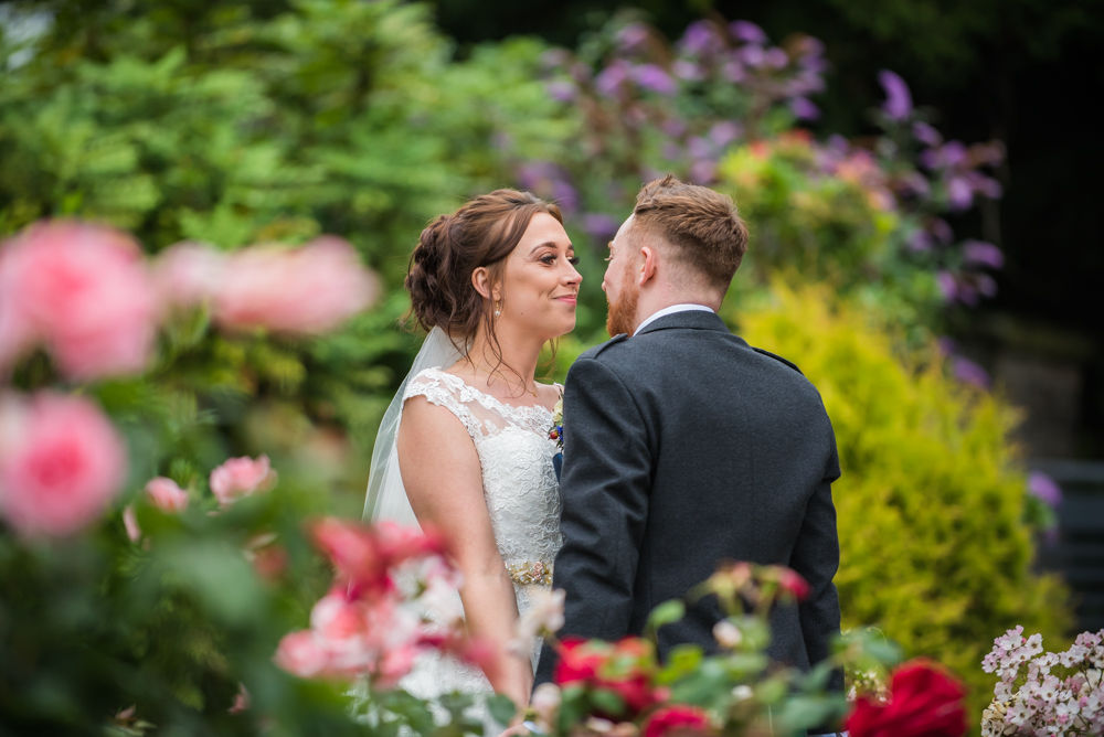 In the rose garden posing, Sheffield wedding photographers, Ringwood Hall Hotel