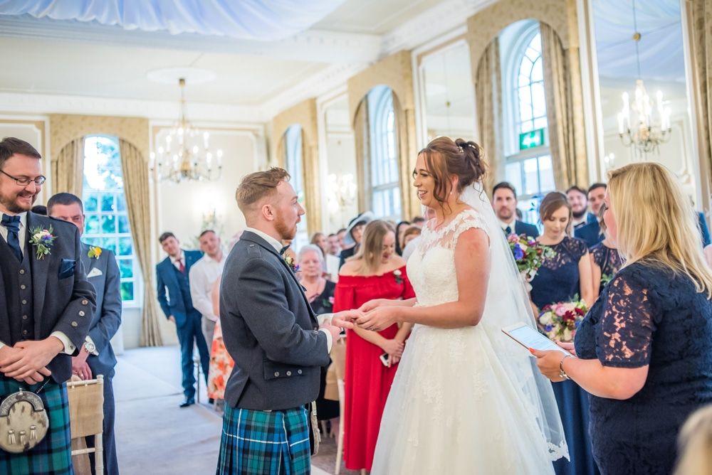 Exchanging rings in wedding ceremony, Sheffield wedding photographers, Ringwood Hall Hotel