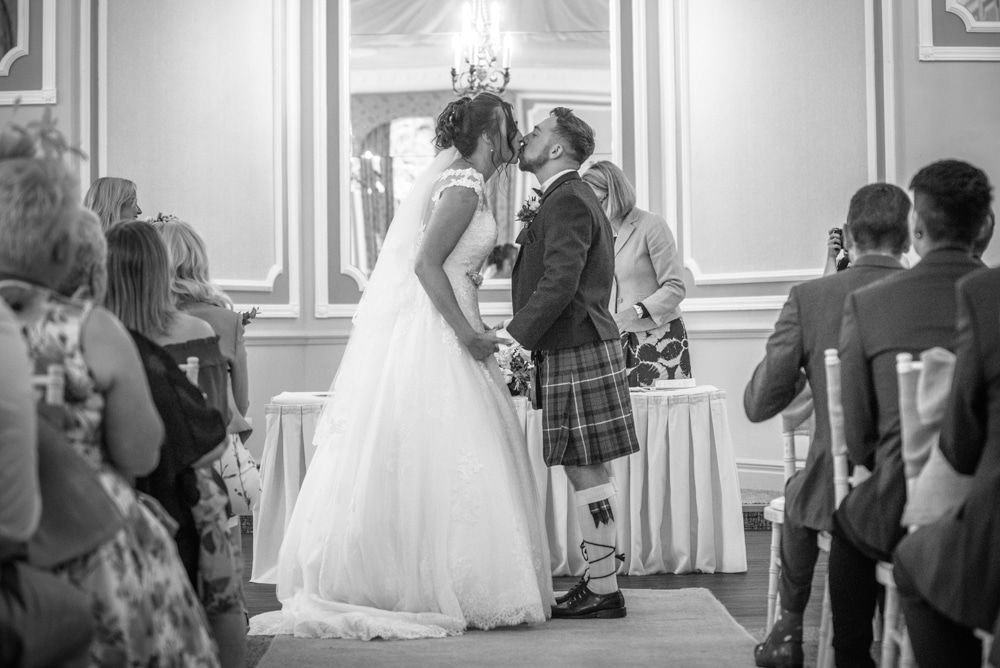 First kiss at wedding, Sheffield wedding photographers, Ringwood Hall Hotel