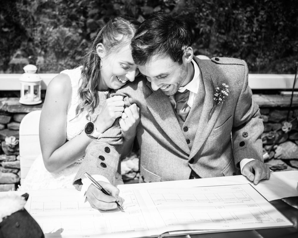 Signing the register, Howgills wedding, Sedbergh, Lake District wedding photographers