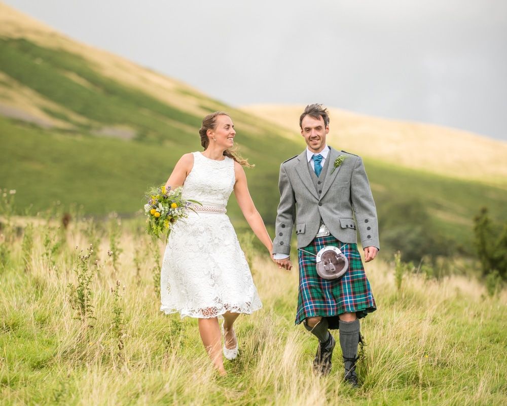 Walking with view of the fells, Howgills wedding, Sedbergh, Lake District wedding photographers