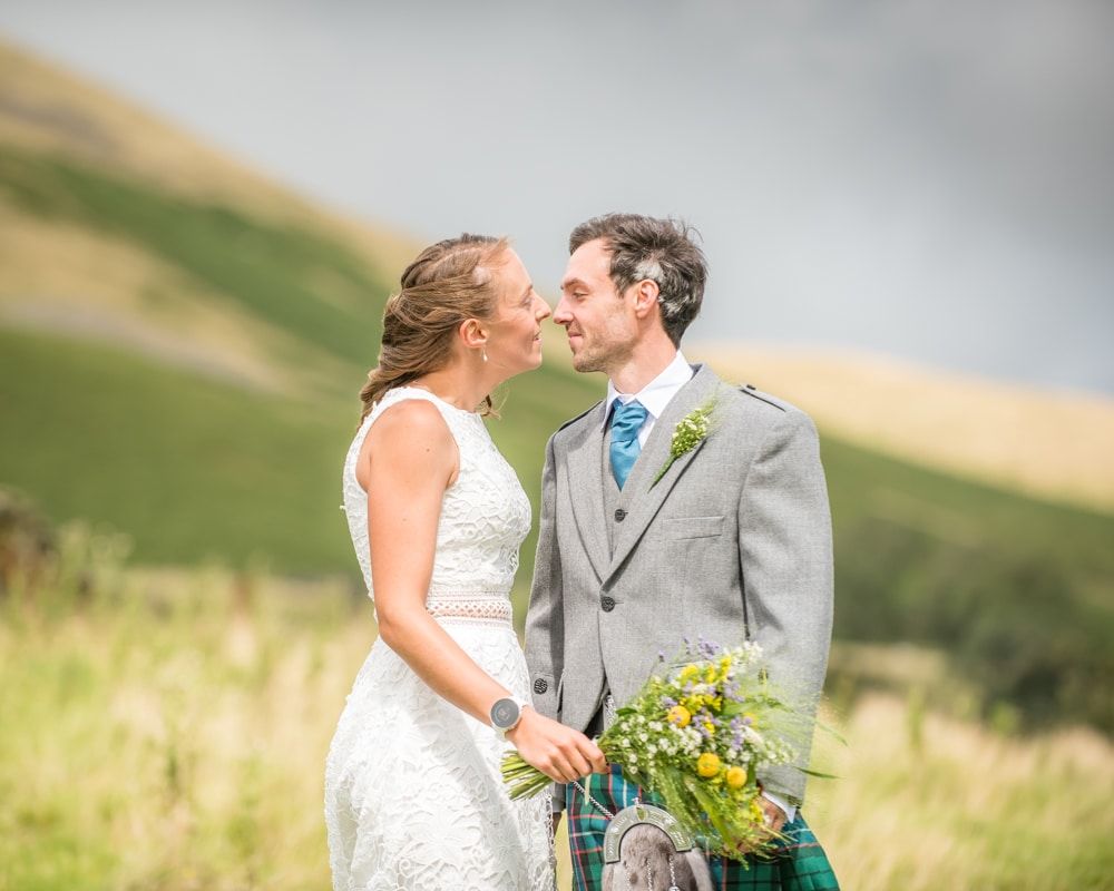 Kisses, Howgills wedding, Sedbergh, Lake District wedding photographers