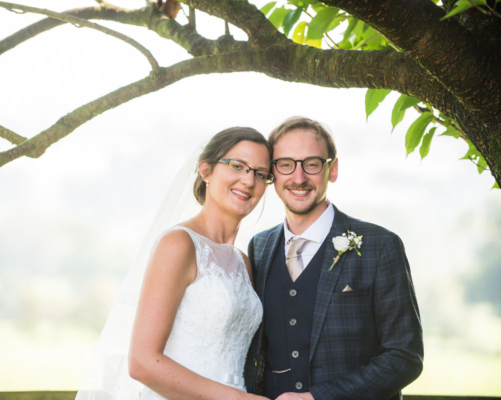 Bride and groom posing for camera, Shireburn Arms, Lancashire wedding photographers