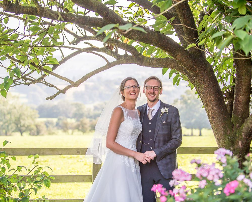 Posing in summery grounds, Shireburn Arms, Lancashire wedding photographers