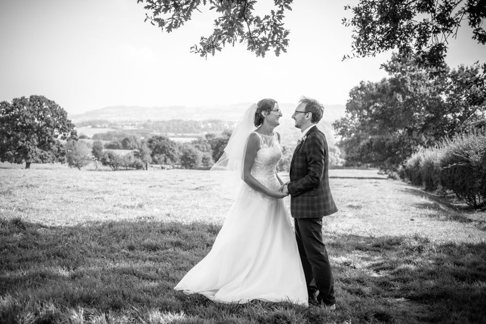 Posing in nearby fields, Shireburn Arms, Lancashire wedding photographers