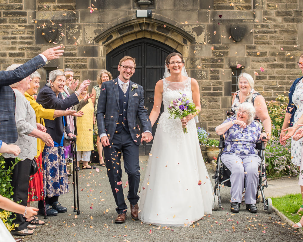 Confetti throwing outside church, Shireburn Arms, Lancashire wedding photographers