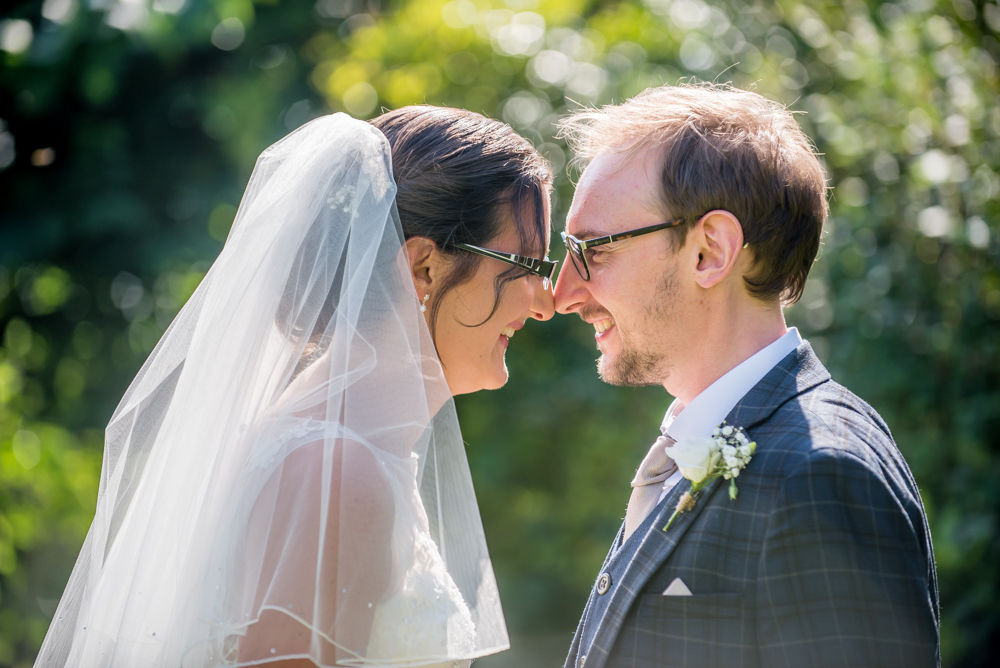 Nose to nose pose, bride and groom, Shireburn Arms, Lancashire wedding photographers